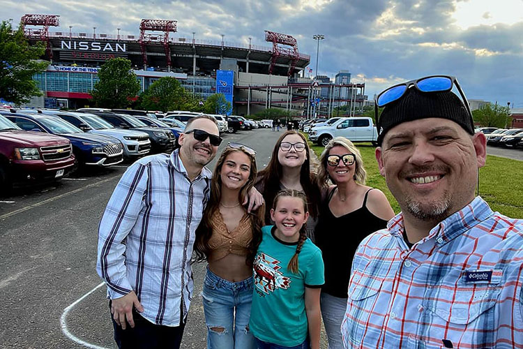 Shaffer with some of the Bredeson family before a concert at Nissan Stadium in Nashville, just three months after the surgery. 
