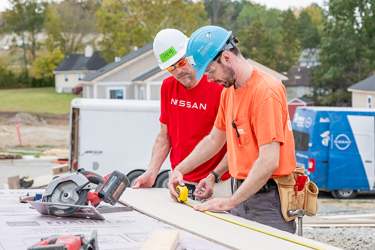 With the help of a site supervisor and construction leader, Nissan volunteers conduct a wide range of homebuilding tasks.